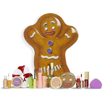 Makeup Revolution London Shrek Gingy 12 Days Advent Calendar Pacco regalo ombretto 2 pz + evidenziatore 1 pz + lucidalabbra 2 pz + rossetto 1 pz + fard 1 pz + gel per sopracciglia 1 pz + pennello 2 pz + spugnetta trucco 1 pz + specchio 1 pz + elastico per capelli 1 pz